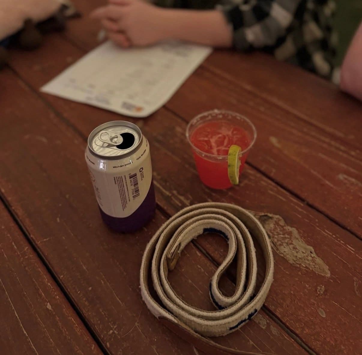 Table with drinks and trivia scorecard